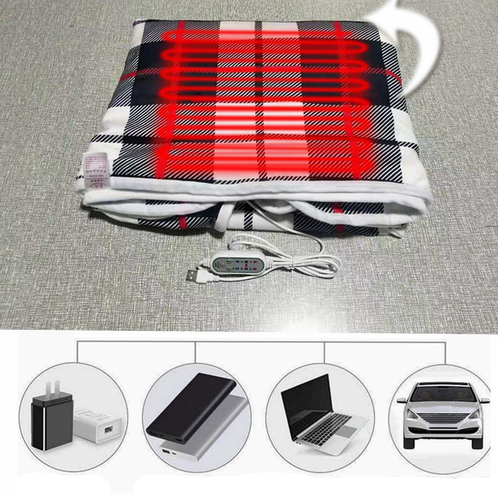 Poncho chauffant à carreaux